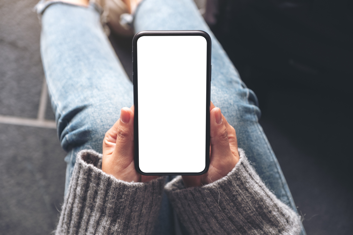 Woman Holding Smartphone with Blank Screen